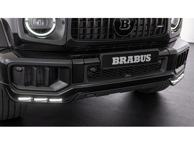 Close-up of a Brabus car front bumper with logo on a dark background