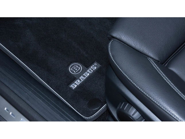 Car interior with Brabus logo on a black carpet
