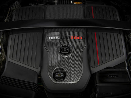Car engine with a prominent brand logo on a dark background
