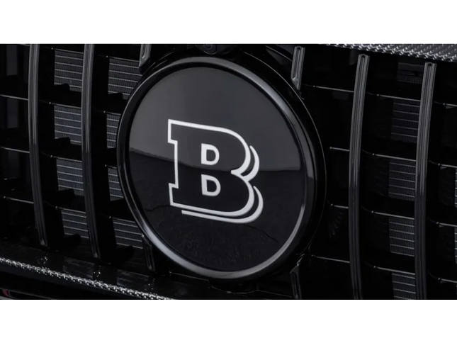Close-up of a car grille with a prominent 'B' logo on a dark background