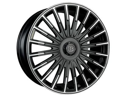 Black car wheel rim with a brand logo on a white background