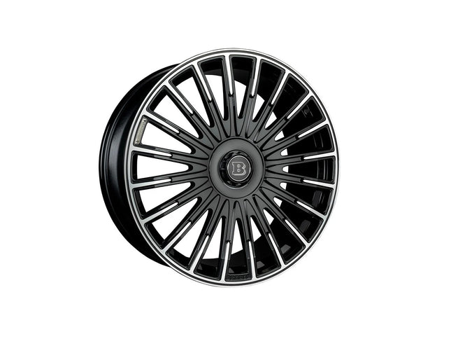 Black car wheel rim with a brand logo on a white background
