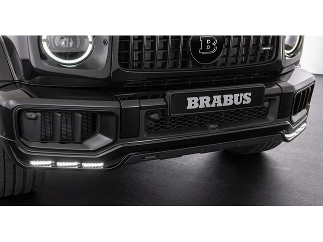 Close-up of a Brabus car front bumper with logo on a dark background