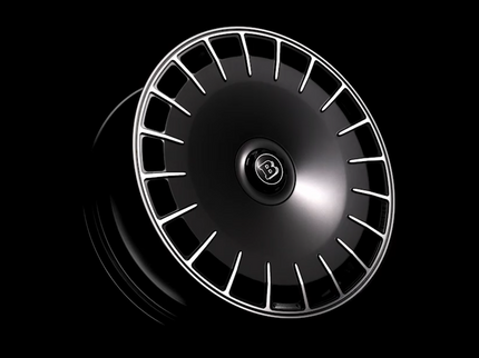 Car wheel rim with a brand logo on a black background