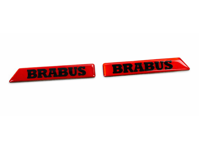 Two red 'BRABUS' emblems on a white background