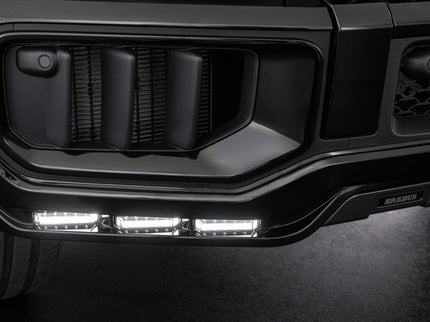 Close-up of a black vehicle grille with LED lights
