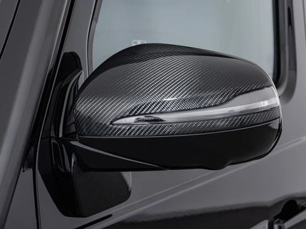 Carbon fiber-textured car side mirror on a vehicle