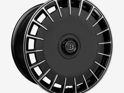 Black alloy wheel with a brand logo on a white background