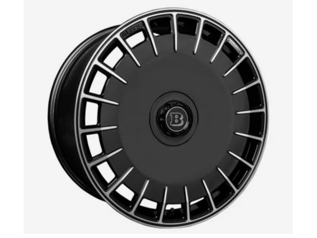 Black alloy wheel with a brand logo on a white background